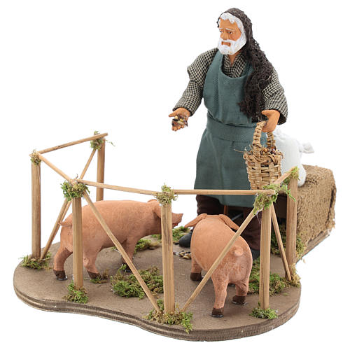 Animated Nativity scene figurine, man feeding pigs 14cm 3