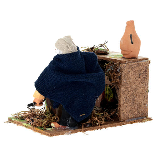 Homme au gril animé pour crèche 8 cm 3