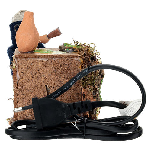 Homme au gril animé pour crèche 8 cm 4