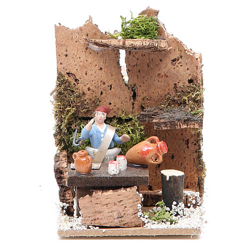 Man at the table measuring 4cm, animated nativity figurine 1