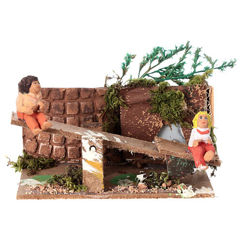 Boy and girl on seesaw measuring 7cm, animated nativity figurine 1