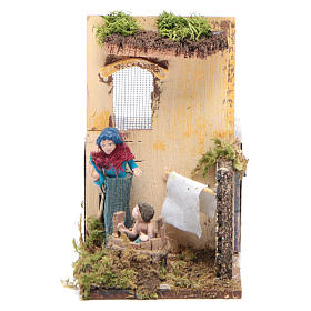 Woman bathing baby measuring 7cm, animated nativity figurine
