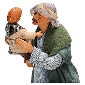 Mężczyzna podnoszący dziecko, szopka neapolitańska 24 cm