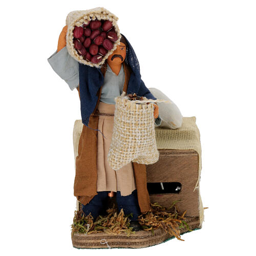 Moving shepherd with bags of seeds for Neapolitan Nativity Scene 10 cm 1