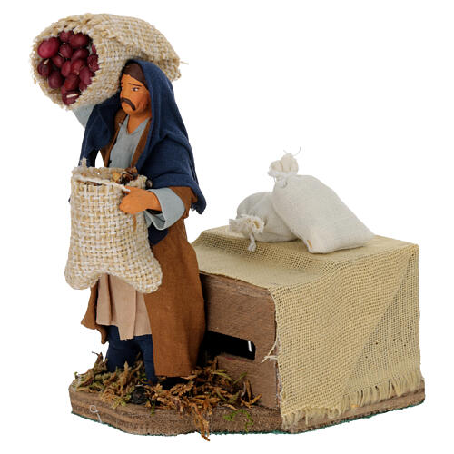 Moving shepherd with bags of seeds for Neapolitan Nativity Scene 10 cm 2