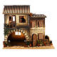 House with animated woman opening window 45x50x30 cm, 12 cm Nativity Scene s1