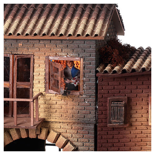 Casa con donna che apre finestra 45x50x30 cm movimento presepe 12 cm 2