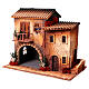 Casa con donna che apre finestra 45x50x30 cm movimento presepe 12 cm s3