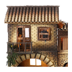 Casa com mulher que abre a janela 45x50x30 cm movimento para presépio com figuras de 12 cm de altura média