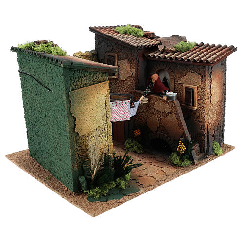 Village with animated woman hanging up the wash 30x45x35 cm, 12 cm nativity 3