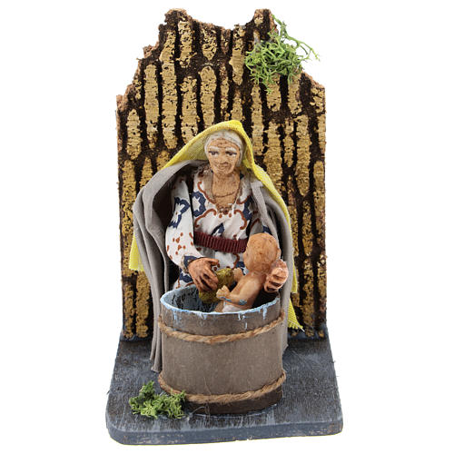 Moving woman washing baby for Neapolitan Nativity Scene 7 cm 1