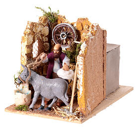 Moving figurine for Neapolitan Nativity scene, man currying donkey 8 cm