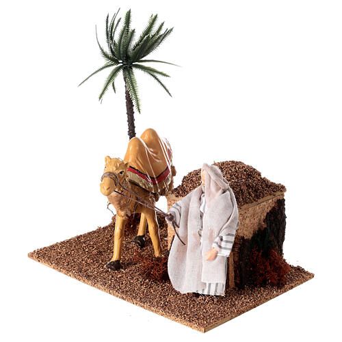 Camel with camel driver with movement for nativity scene 12 cm 25x20x15 cm 2