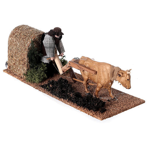 Farmer with ox in motion for Nativity Scene with 12 cm characters 10x10x30 cm 3