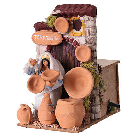 Vendedora de objetos de terracota com movimento para presépio 10 cm 10x10x15 cm