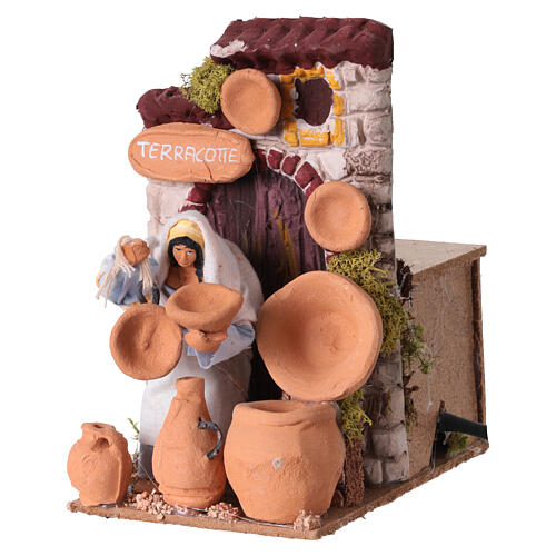 Vendedora de objetos de terracota com movimento para presépio 10 cm 10x10x15 cm 2