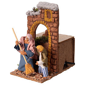 Woman sweeping animated nativity scene 10x15x15 cm, 10 cm terracotta