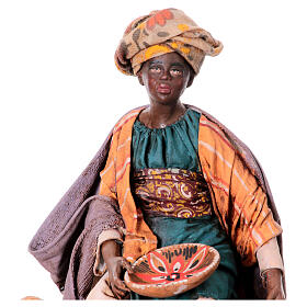 Mulher negra sentada com objectos de cerâmica 18 cm Angela Tripi