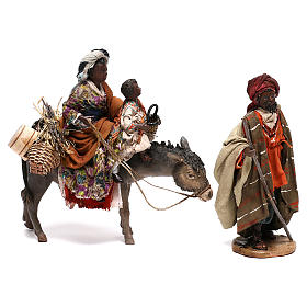 Mujer con niño sobre mula y pastor belén Angela Tripi