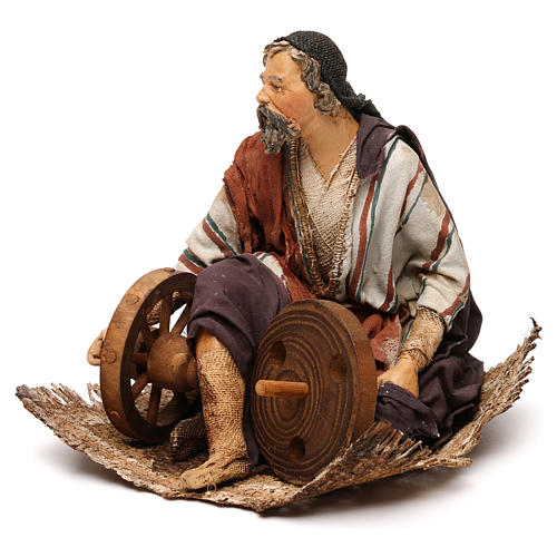 Shepherd sitting with wheel, 18 cm by Angela Tripi 3