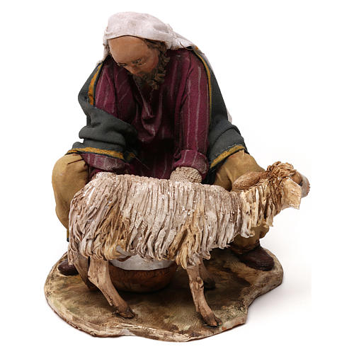 Man milking goat for 13 cm Nativity scene, Angela Tripi 1