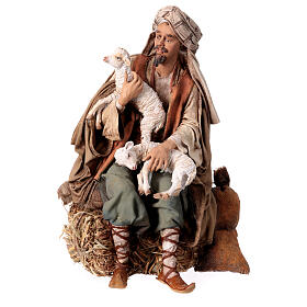 Shepherd sitting with sheep, 30 cm Angela Tripi figurine