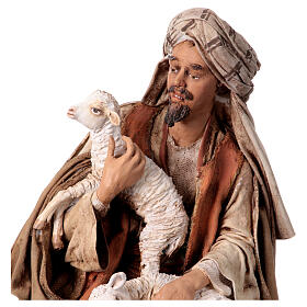 Shepherd sitting with sheep, 30 cm Angela Tripi figurine