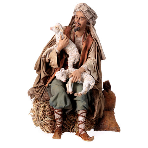 Shepherd sitting with sheep, 30 cm Angela Tripi figurine 1