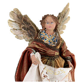Nativity scene figurine, Angel with Gloria banner and red mantle by Angela Tripi 13 cm