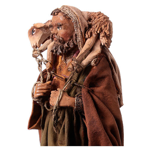 Nativity scene figurine, Shepherd carrying a sheep by Angela Tripi 13 cm 2