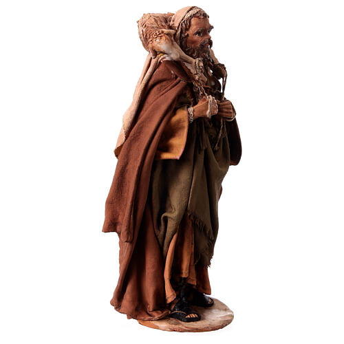Nativity scene figurine, Shepherd carrying a sheep by Angela Tripi 13 cm 4