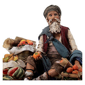 Fruit salesman sitting down for Tripi's Nativity Scene with 18 cm terracotta characters