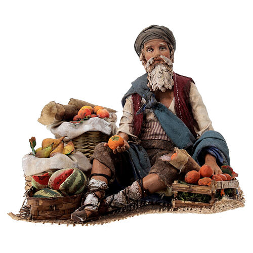 Fruit salesman sitting down for Tripi's Nativity Scene with 18 cm terracotta characters 1