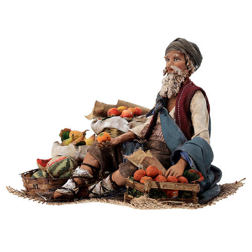 Fruit salesman sitting down for Tripi's Nativity Scene with 18 cm terracotta characters 3