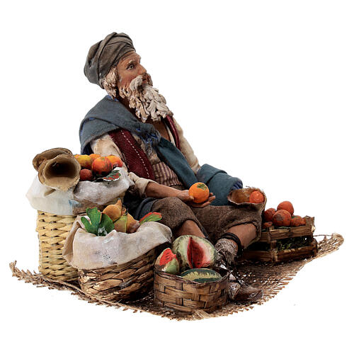 Fruit salesman sitting down for Tripi's Nativity Scene with 18 cm terracotta characters 4