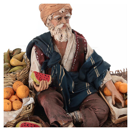 Fruit salesman sitting down for Tripi's Nativity Scene with 18 cm terracotta characters 4