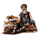 Fruit salesman sitting down for Tripi's Nativity Scene with 18 cm terracotta characters s1