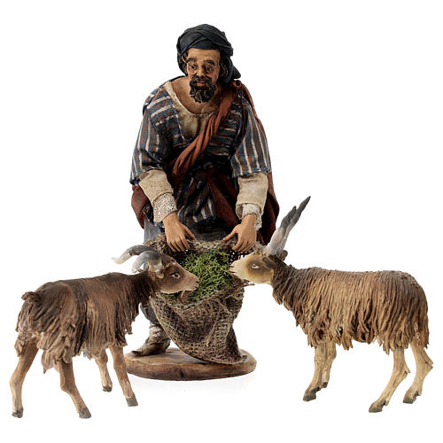 Shepherd feeding goats for Tripi's Nativity Scene with 18 cm terracotta characters 1