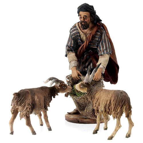 Shepherd feeding goats for Tripi's Nativity Scene with 18 cm terracotta characters 5