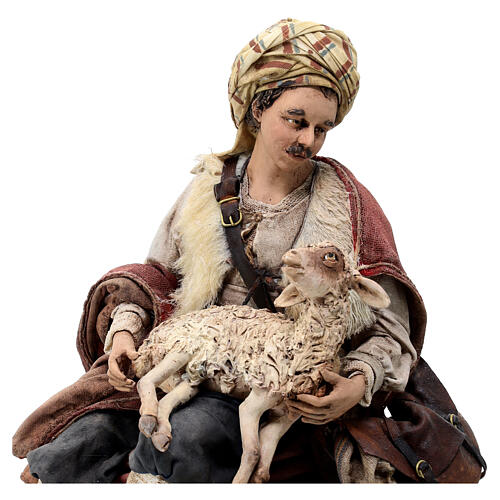 Shepherd sitting with a sheep for terracotta Angela Tripi's Nativity Scene of 30 cm 2