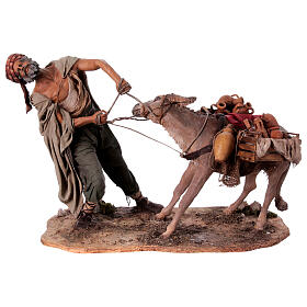 Shepherd pulling the donkey figure Angela Tripi terracotta 30 cm