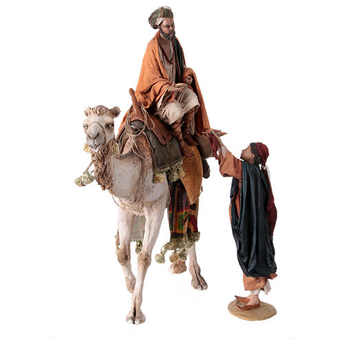 Shepherd on a camel with woman offering him food for terracotta Angela Tripi's Nativity Scene of 30 cm 1