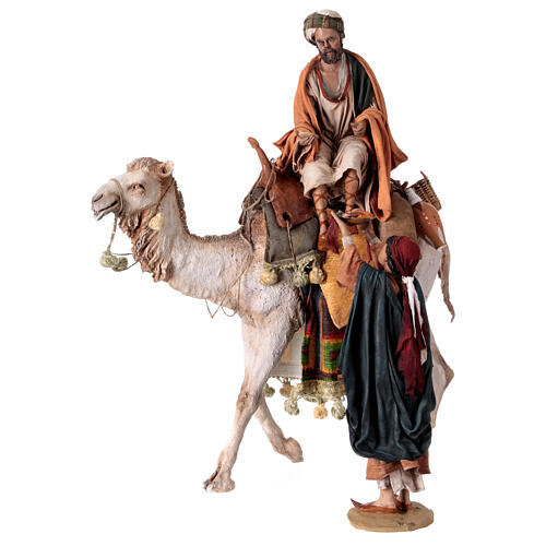 Shepherd on a camel with woman offering him food for terracotta Angela Tripi's Nativity Scene of 30 cm 7