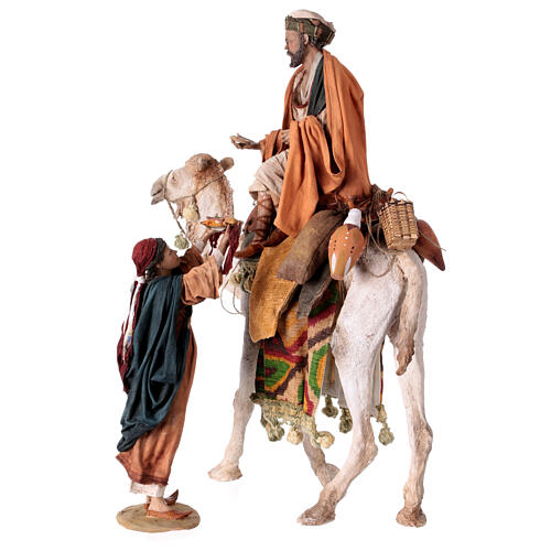 Shepherd on a camel with woman offering him food for terracotta Angela Tripi's Nativity Scene of 30 cm 11