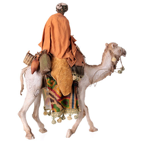 Shepherd on a camel with woman offering him food for terracotta Angela Tripi's Nativity Scene of 30 cm 18