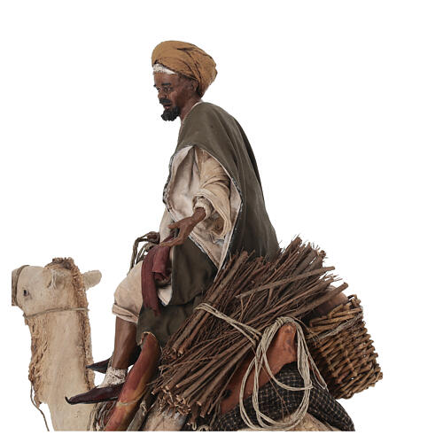 Shepherd on a camel with woman offering him food for terracotta Angela Tripi's Nativity Scene of 30 cm 11