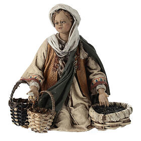Young man on his knees with baskets, Angela Tripi's Nativity Scene of 13 cm