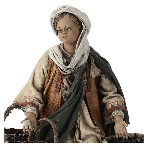 Young man on his knees with baskets, Angela Tripi's Nativity Scene of 13 cm 2