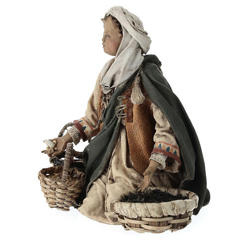Young man on his knees with baskets, Angela Tripi's Nativity Scene of 13 cm 3
