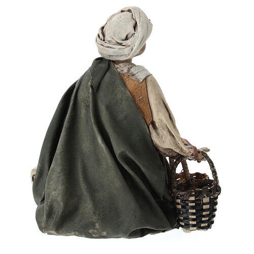 Young man on his knees with baskets, Angela Tripi's Nativity Scene of 13 cm 5